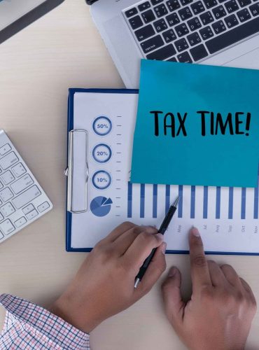 time-taxes-planning-money-financial-accounting-taxation-businessman-min